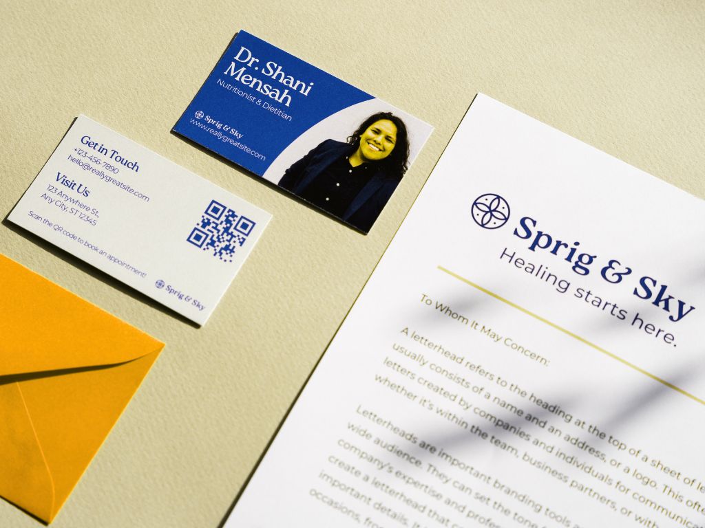 The power of printed collateral showcased through branded business cards, brochures, and packaging arranged in a modern flat lay design.